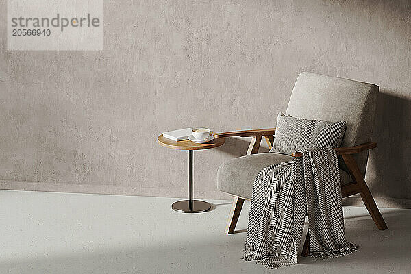 Small coffee table and armchair standing in corner of beige room