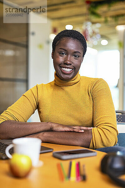 Smiling businesswoman at coworking space