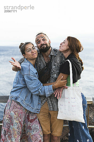 Playful group of friends posing at Tenerife island in Spain