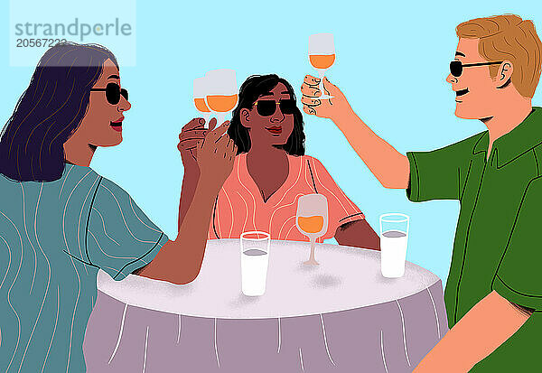 Friends toasting wineglasses at table by sea