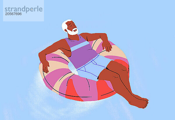 Man relaxing on swimming float against blue background