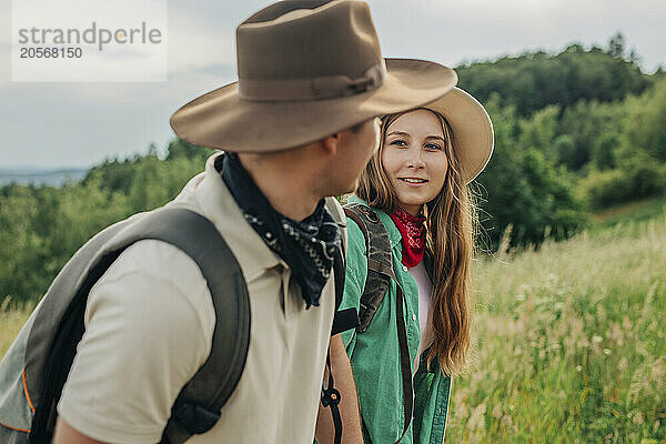 Young woman hiking with boyfriend on mountain in Poland