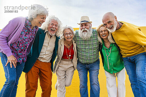 Cheerful elderly friends having fun together