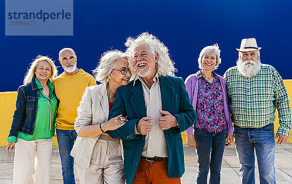 Cheerful elderly friends enjoying leisure time together