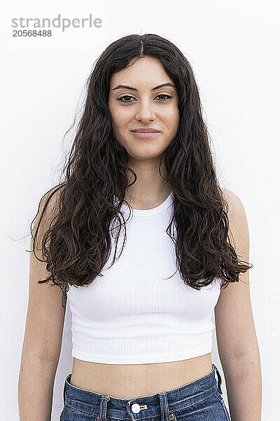 Beautiful woman posing against white background