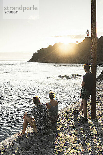 Friends looking at view near sea in Tenerife island