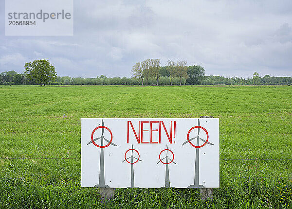 Sign of new wind turbines protest on green field