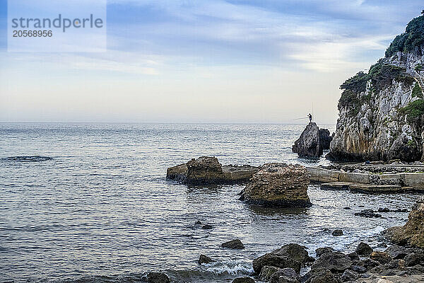 Rocks near Argentario sea under cloudy sky at Maremma  Tuscany  Italy