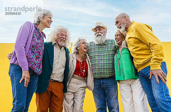 Cheerful senior friends spending leisure time together