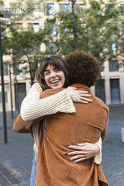 Happy woman embracing boyfriend