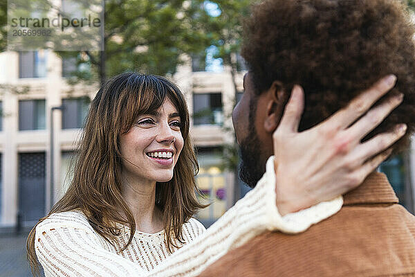 Happy loving woman looking at boyfriend