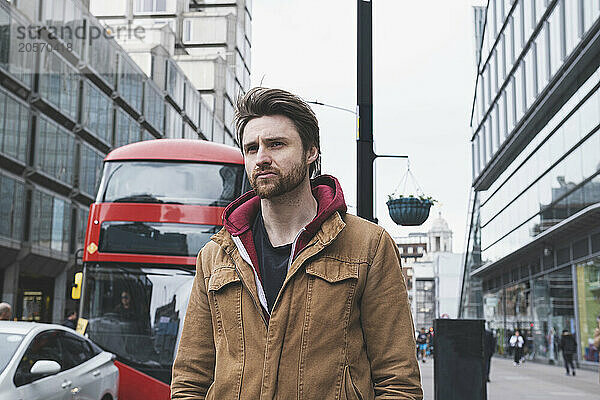 Confused man walking on street