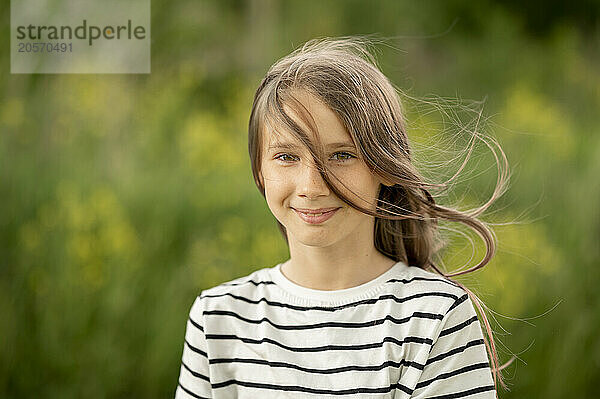 Smiling girl with brown hair