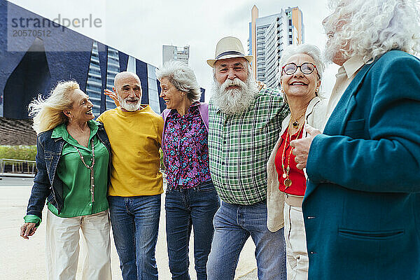 Happy senior friends enjoying in city