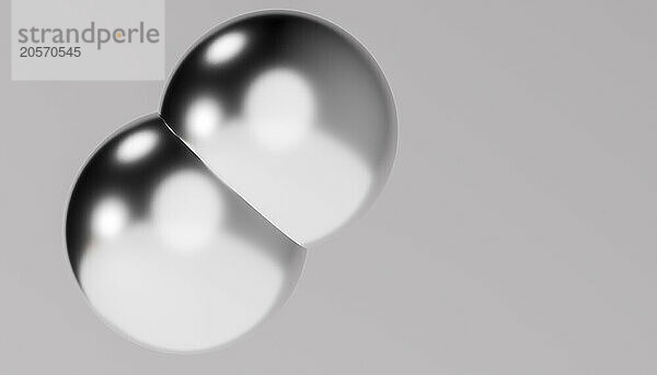 3d rendering of shiny metallic balls against gray background