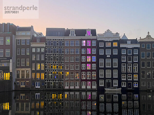 Dancing Houses near Amstel river at sunrise