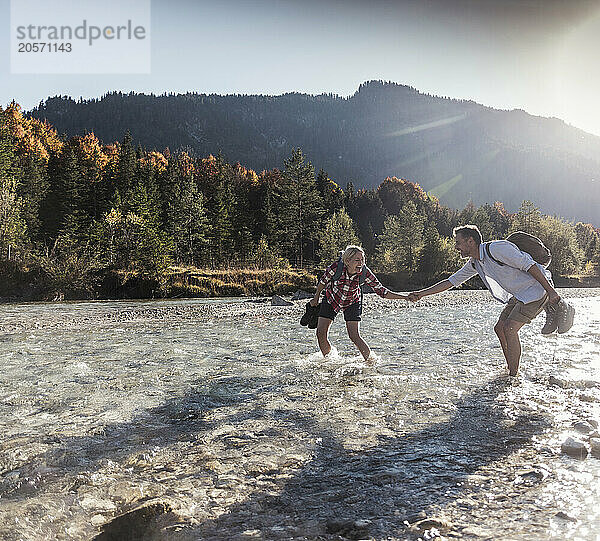 Mature couple enjoying in river on weekend