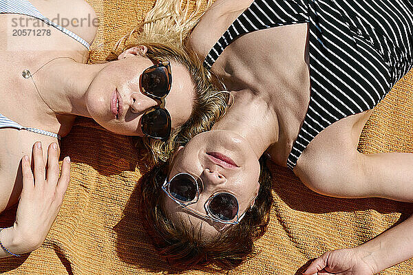 Beautiful women sunbathing at beach