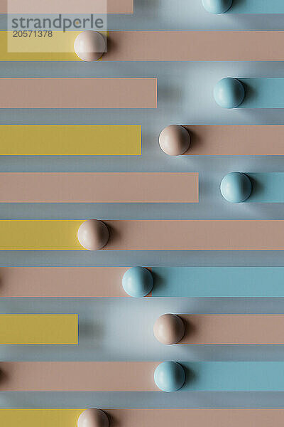 3D render of multi colored bars with spheres