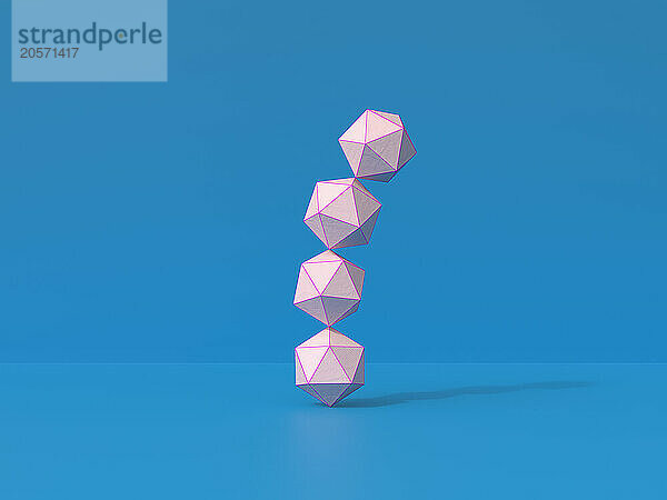 Stack of paper polygons on blue background