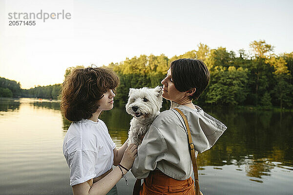 Mother and daughter dog near river