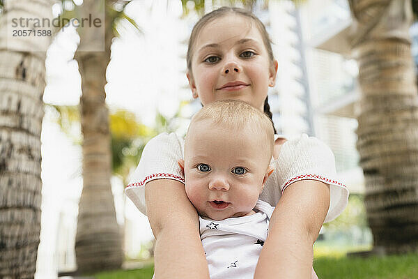 Cute brother and sister in garden