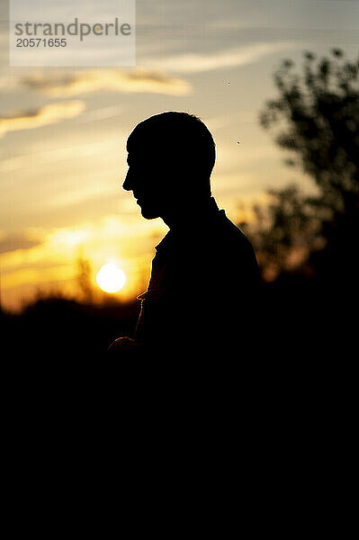 Silhouette of man at sunset