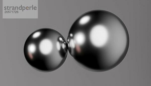 3d rendering of shiny metallic balls against colored background