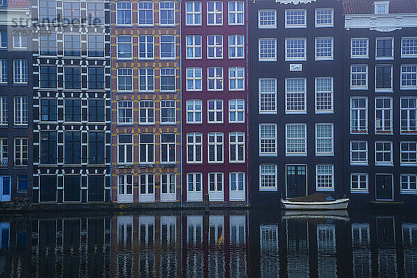 Dancing Houses in Amsterdam at foggy day