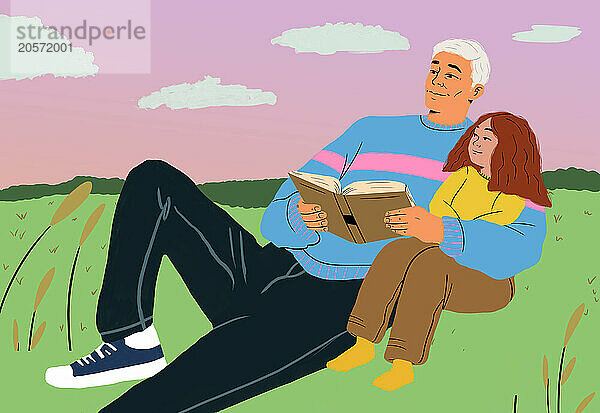 Grandfather storytelling granddaughter and lying on agricultural field during sunset