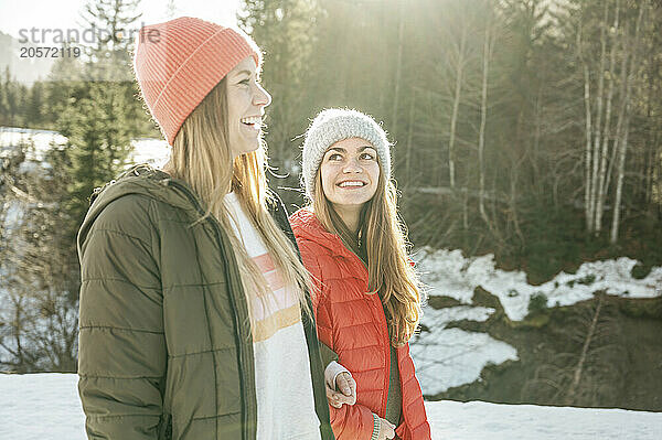 Happy friends enjoying winter vacation together