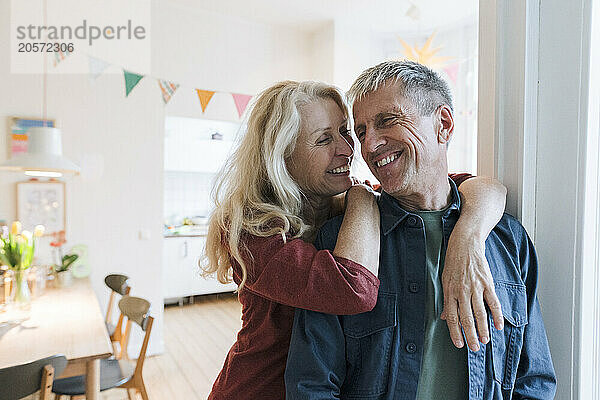 Smiling senior couple at home