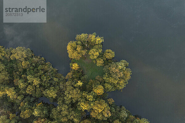 Germany  Bavaria  Aerial view of morning fog floating over river Main in autumn