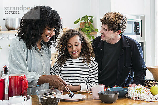 Mother sharing homemade sushi with her family