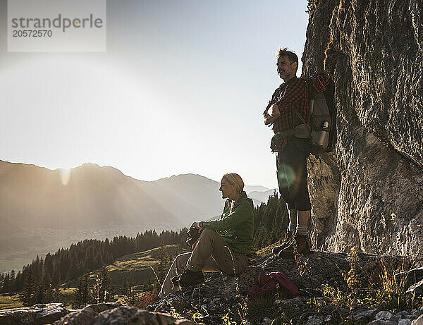 Carefree mature couple looking at view on mountain of Tyrol