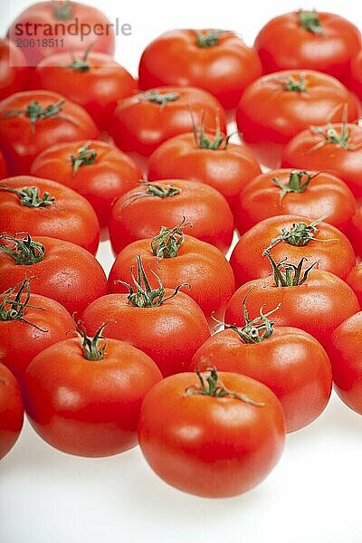 Lots of tomatoes isolated on white