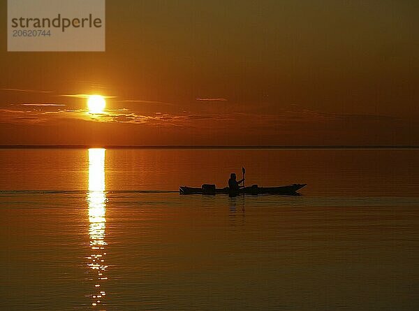 Canoeist at sunset on lake Vänern. Canoeist at sunset on lake vänern