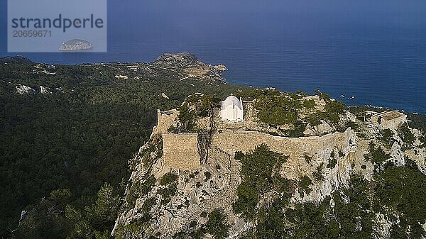 Aerial view of an old fortress on a rocky hill surrounded by sea and forest  Kastro Monolithou  Monolithos Castle  rock castle  Monolithos village  Rhodes  Dodecanese  Greek Islands  Greece  Europe