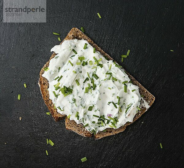 Slice of Bread with Herb Curd (detailed close-up shot)