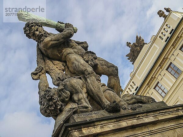 Battling Titan with hulking stick at Prague castle entrance