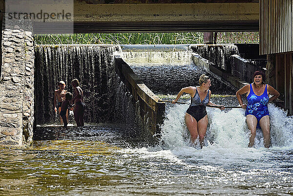 Family hydromassage at the Watermill at Ginuciai  Aukstaitija National Park  Lithuania  Europe