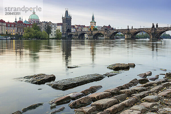 Charles Bridge  OId Town Bridge Tower and dome of St. Francis of Assisi Church by Vltava River  UNESCO World Heritage Site  Prague  Czech Republic (Czechia)  Europe