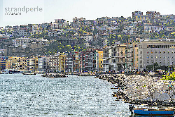 View of pastel coloured architecture on waterfront of Via Francesco Caracciolo  Naples  Campania  Italy  Europe