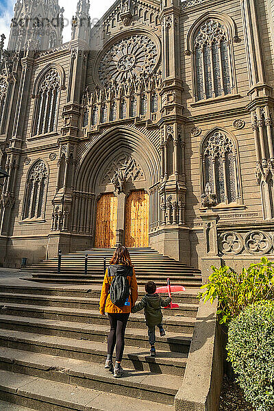 A mother with her son visiting the Church of San Juan Bautista  Arucas Cathedral  Gran Canaria  Spain  Europe