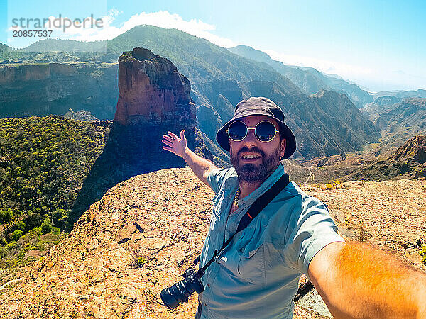 Selfie of a man at the Roque Palmes viewpoint near Roque Nublo in Gran Canaria  Canary Islands