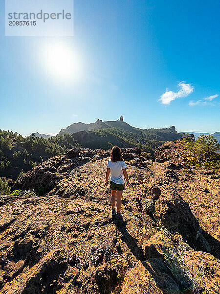 A woman hiker at a viewpoint of Roque Nublo in Gran Canaria  Canary Islands