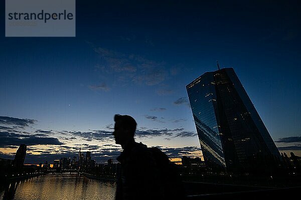 The remaining light of day is reflected in the glass façade of the European Central Bank (ECB) in Frankfurt am Main  Frankfurt am Main  Hesse  Germany  Europe