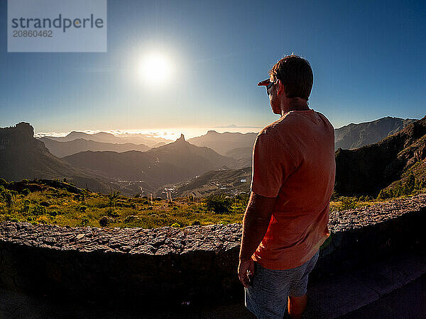 A young boy at sunset near Roque Nublo in Gran Canaria  Canary Islands