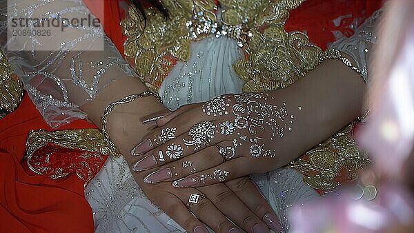 Hands of the bride and groom with wedding rings on their hands