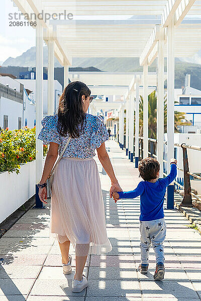 A mother with her son on vacation at Puerto de Las Nieves in Agaete on Gran Canaria  Spain  Europe